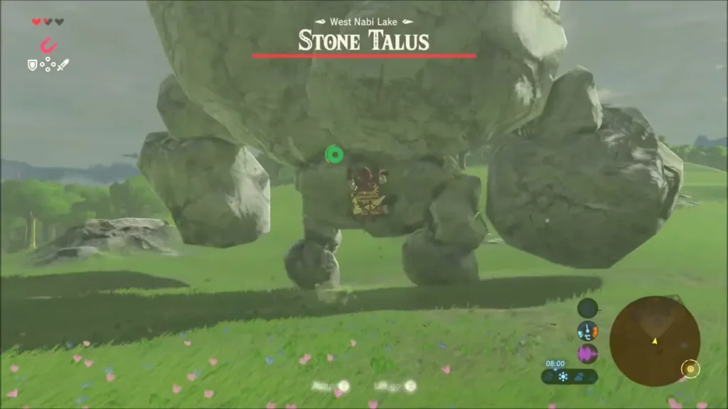 Link facing a towering Stone Talus on the grassland, its ore glowing underneath Link facing a towering Stone Talus on the grassland, its ore glowing underneath