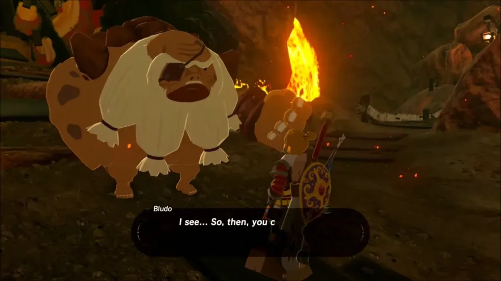 Bludo, the Goron Boss, speaking with Link beside a lava-lit mine tunnel in Goron City Bludo, the Goron Boss, speaking with Link beside a lava-lit mine tunnel in Goron City