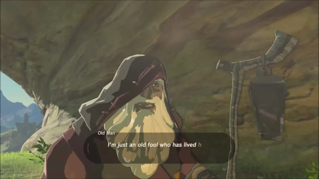 Close view of the hooded Old Man with his lantern staff