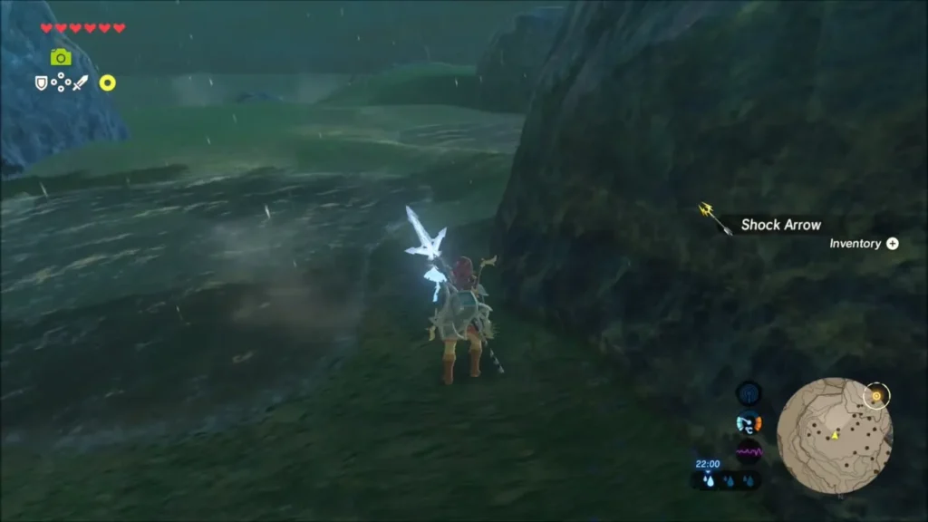Link picking up a Shock Arrow at night Link picking up a Shock Arrow at night