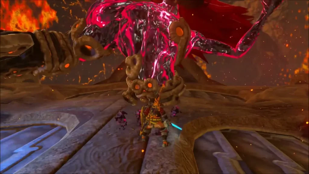 Link dodging beneath Fireblight Ganon as he winds up a heavy attack
