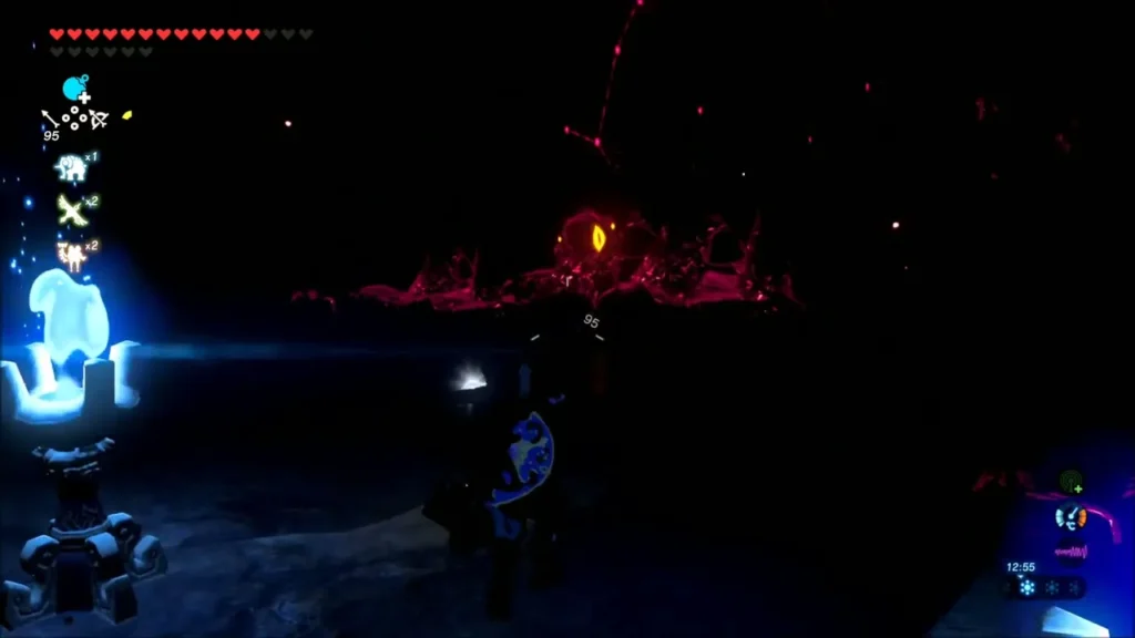Link in the dark interior beside a blue flame, facing a glowing Blight eye