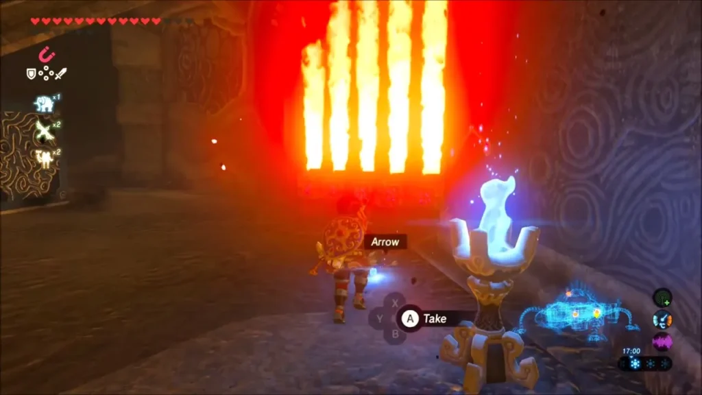Link beside a lit brazier with a wall of flame jets behind him in Vah Rudania