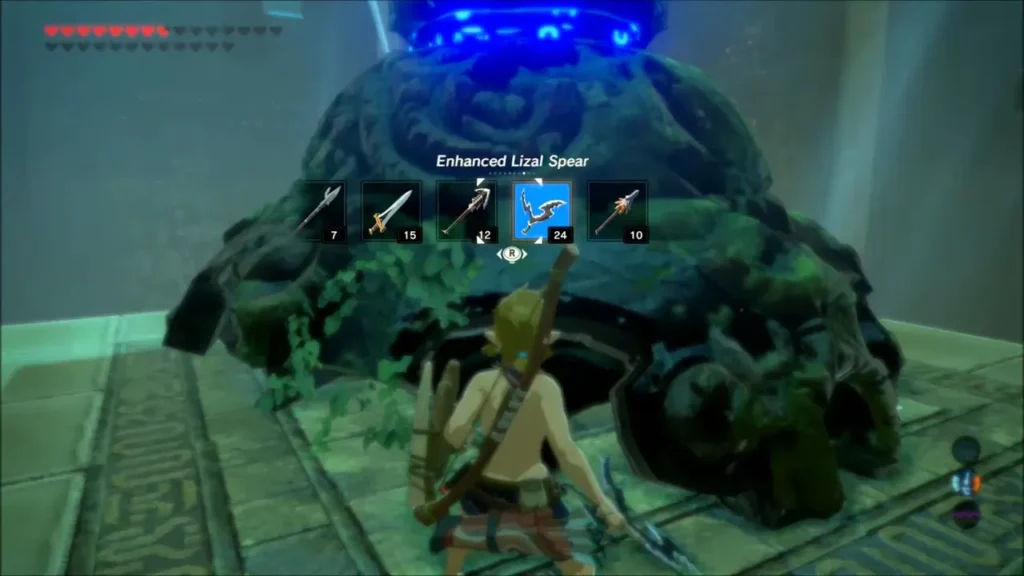 Link crouching before a dormant mossy Decayed Guardian in a shrine Link crouching before a dormant mossy Decayed Guardian in a shrine
