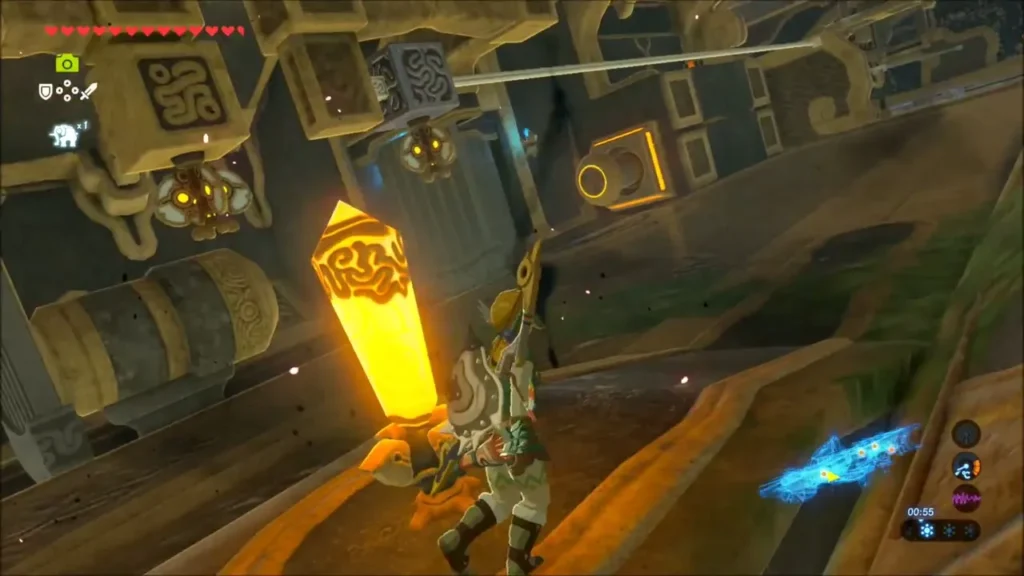 Link striking the glowing orange switch crystal under hanging metal blocks Link striking the glowing orange switch crystal under hanging metal blocks
