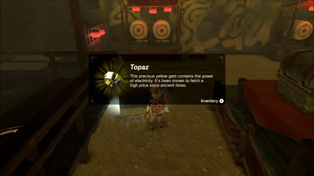 Link holding up a Topaz in the Yiga hideout's last room Link holding up a Topaz in the Yiga hideout's last room