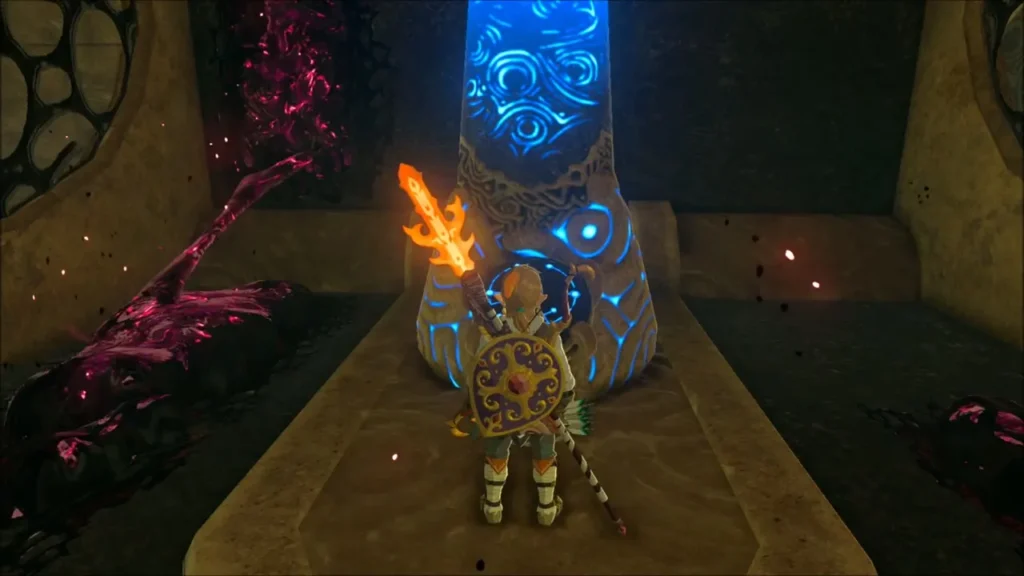 Link with flame sword at a glowing blue terminal beside Malice inside Vah Naboris Link with flame sword at a glowing blue terminal beside Malice inside Vah Naboris