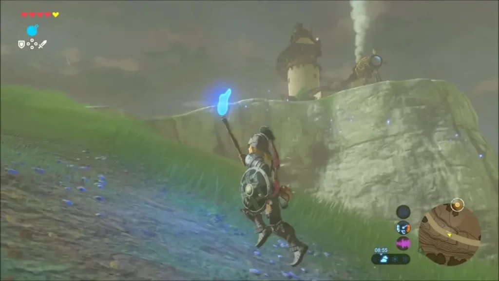 Link climbing the hill toward the Hateno laboratory with a lit torch Link climbing the hill toward the Hateno laboratory with a lit torch