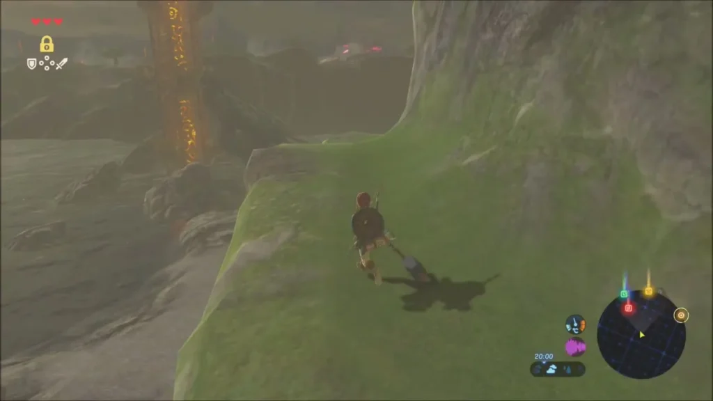 Dueling Peaks Tower rising in the distance beside a cliff path Dueling Peaks Tower rising in the distance beside a cliff path