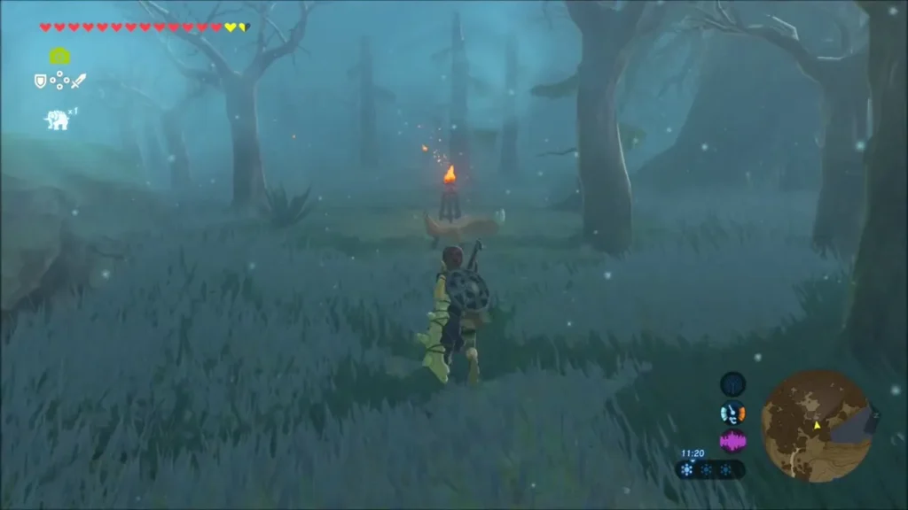 Link heading toward a lit torch through the fog of the Lost Woods Link heading toward a lit torch through the fog of the Lost Woods