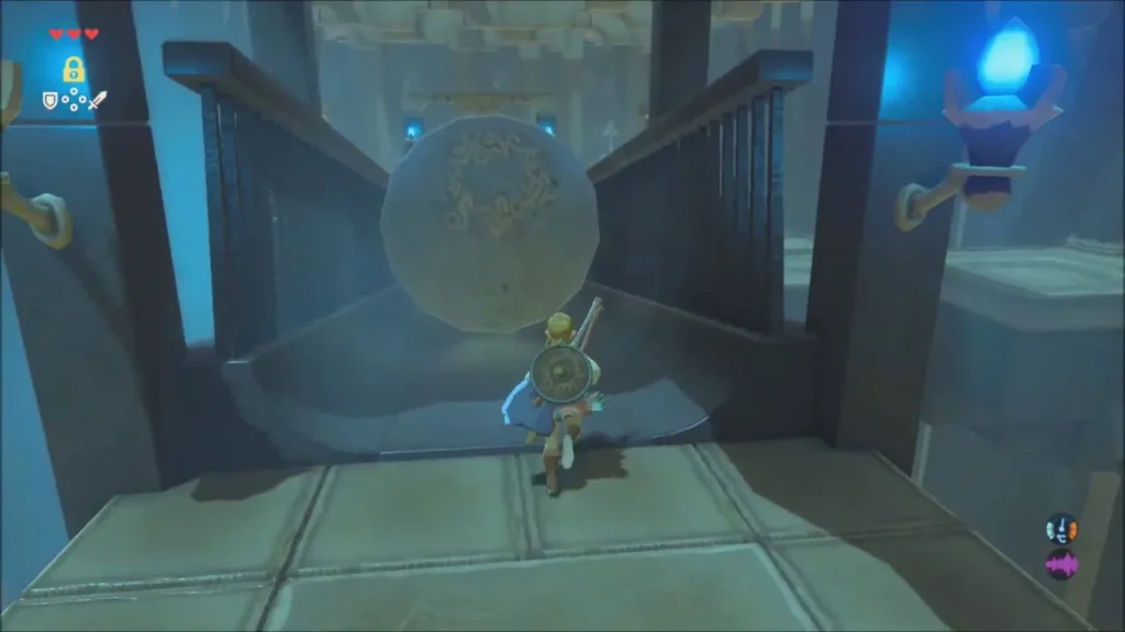 Link facing a large boulder rolling down the ramp in Owa Daim Shrine Link facing a large boulder rolling down the ramp in Owa Daim Shrine