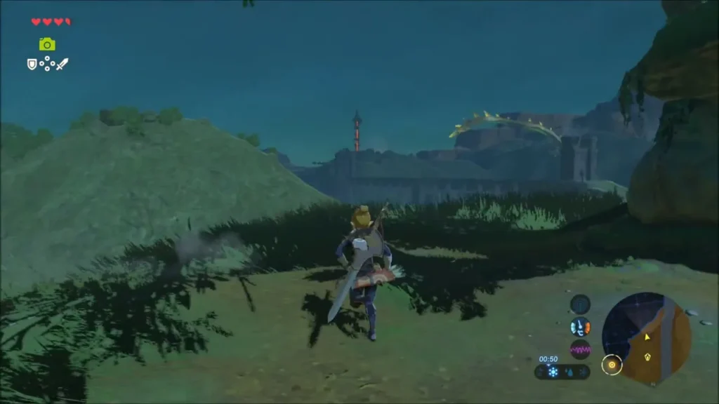 Link on a grassy rise with the Bridge of Hylia and its tower across the water Link on a grassy rise with the Bridge of Hylia and its tower across the water