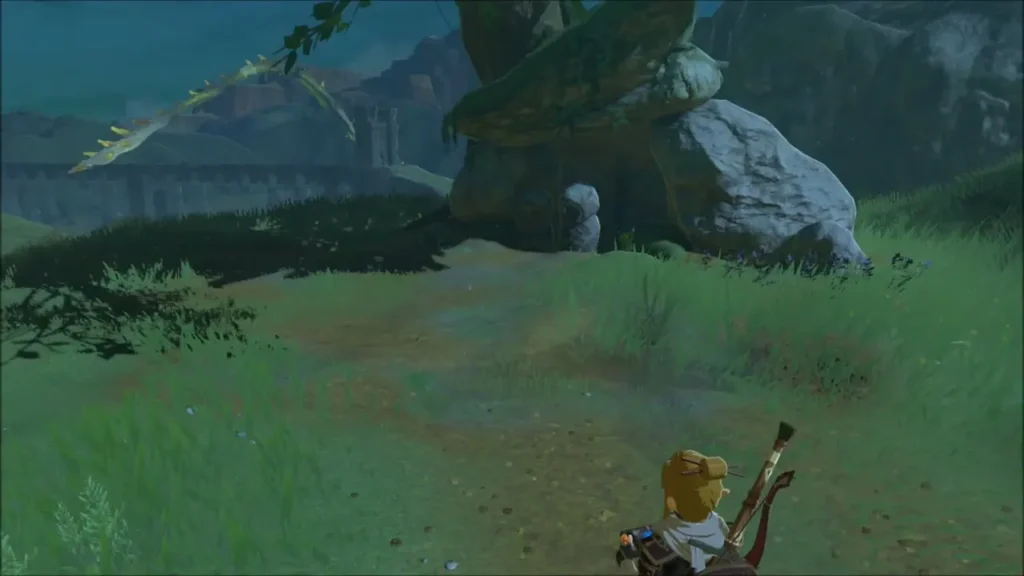 Hill with a large tree and the Bridge of Hylia stretching in the distance Hill with a large tree and the Bridge of Hylia stretching in the distance