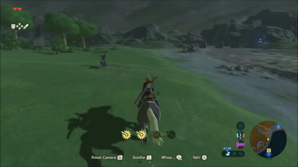 Link riding a horse along the grassy shore of the large lake Link riding a horse along the grassy shore of the large lake