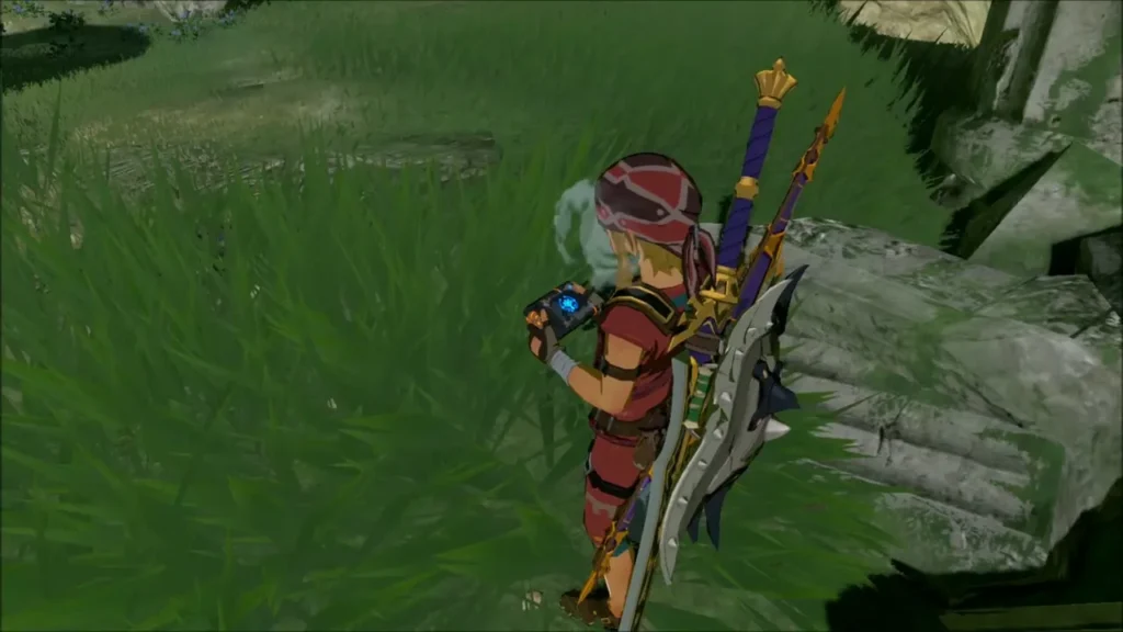 Link holding the Sheikah Slate on the memory spot by the shrine