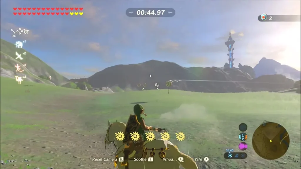 Link riding across the grassy course shooting at targets Link riding across the grassy course shooting at targets