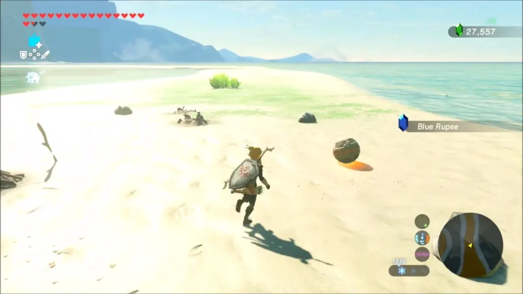 Link running past the ancient orb resting on the sandy shore Link running past the ancient orb resting on the sandy shore