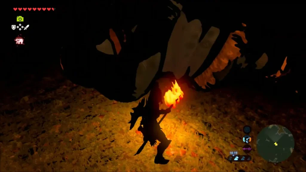 Link with a torch beside the huge sleeping Hinox Link with a torch beside the huge sleeping Hinox