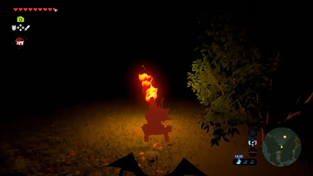 A lit bird-shaped statue glowing in the dark A lit bird-shaped statue glowing in the dark