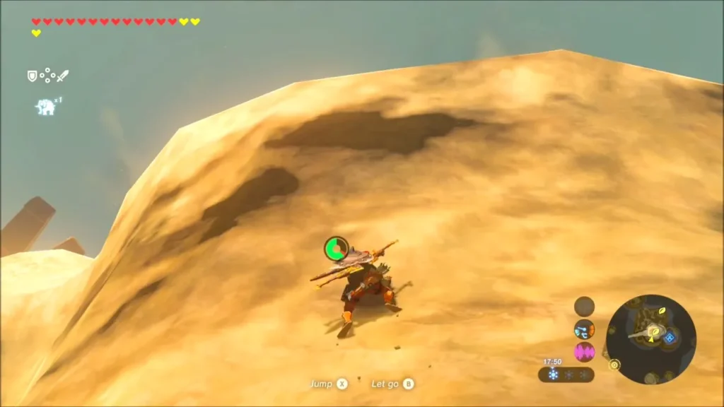 Link scaling a steep sandy rock slope near the top Link scaling a steep sandy rock slope near the top