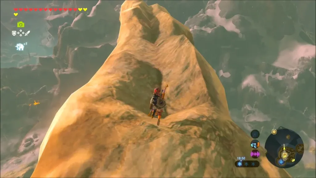 Link climbing a bare rock spire above the snowy Hebra mountains Link climbing a bare rock spire above the snowy Hebra mountains