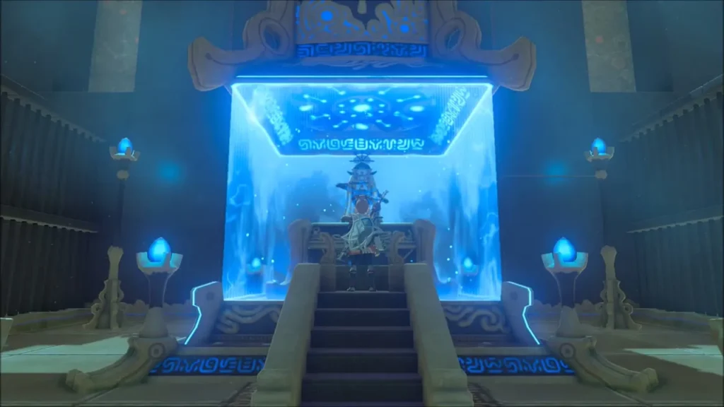 Monk Mezza Lo seated on the shrine dais behind a blue barrier Monk Mezza Lo seated on the shrine dais behind a blue barrier