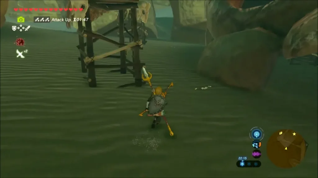 Link running across the dark desert sand at night past a watchtower Link running across the dark desert sand at night past a watchtower