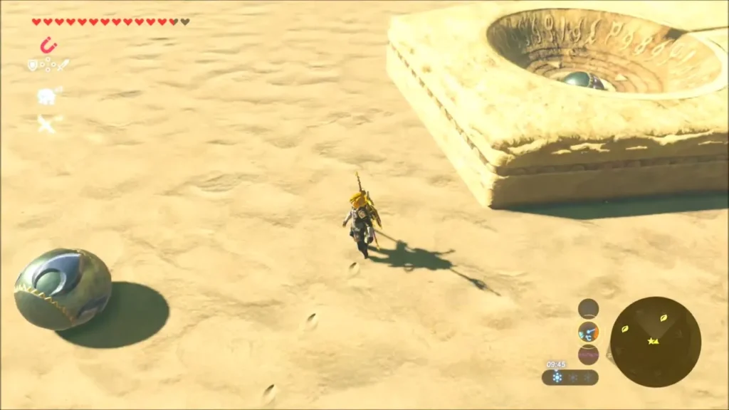 An ancient orb lying in the sand near a stone pedestal An ancient orb lying in the sand near a stone pedestal