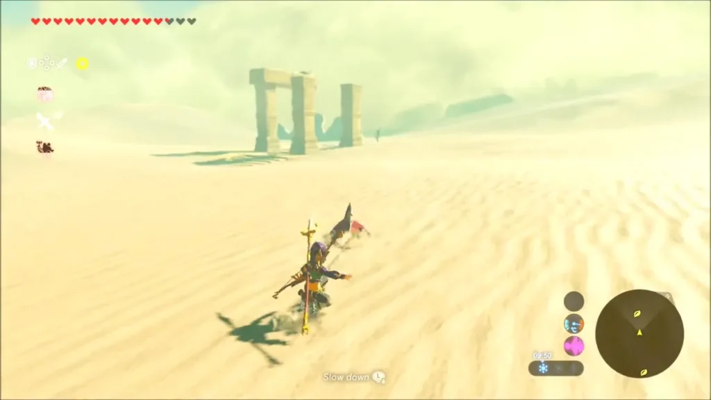 Link riding a sand seal toward a stone archway on the horizon
