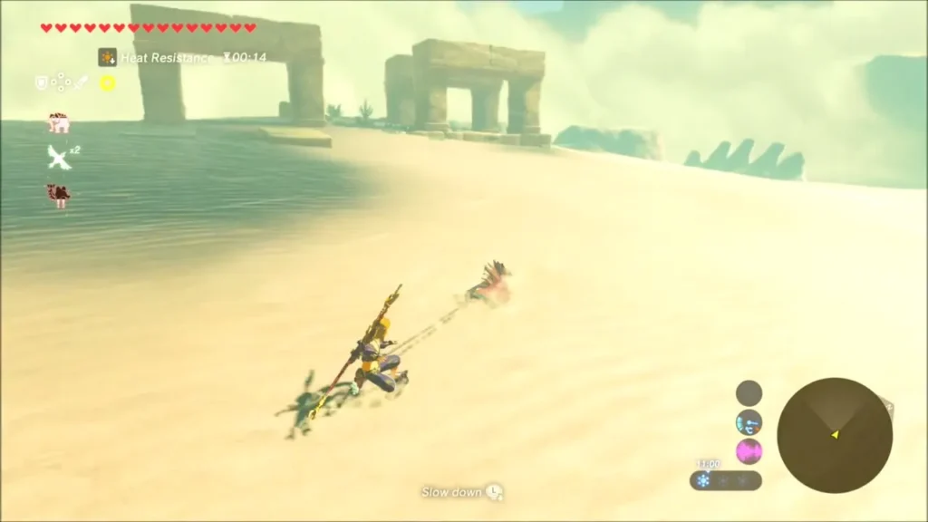 Link sand-sealing across a dune toward distant sandstone ruins