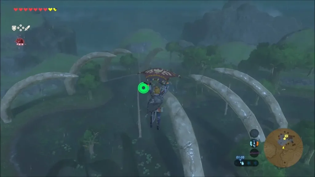 Link gliding down toward the Hinox's island between huge bone arches Link gliding down toward the Hinox's island between huge bone arches