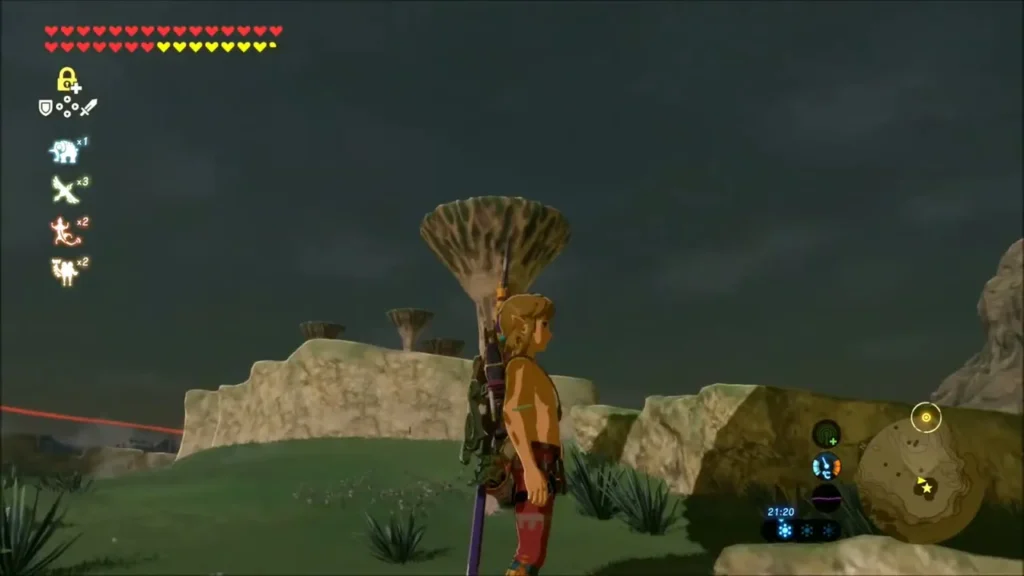 Link in climbing gear beneath a tall mushroom-shaped pillar at dusk Link in climbing gear beneath a tall mushroom-shaped pillar at dusk