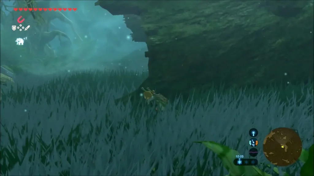 Link crouched in grass at the far end of the hollow log Link crouched in grass at the far end of the hollow log