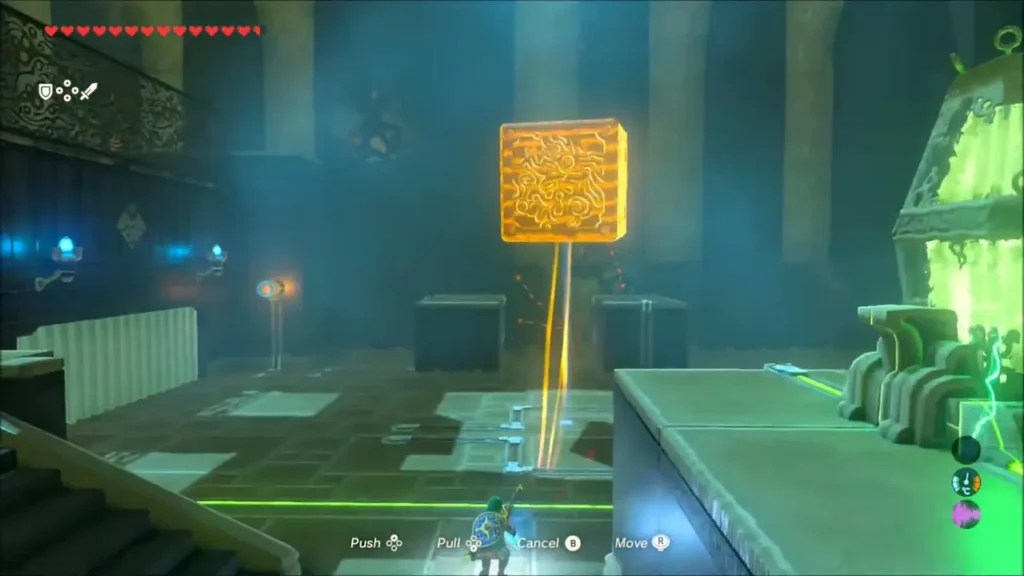Link bringing a large metal block toward the hall's raised platform Link bringing a large metal block toward the hall's raised platform