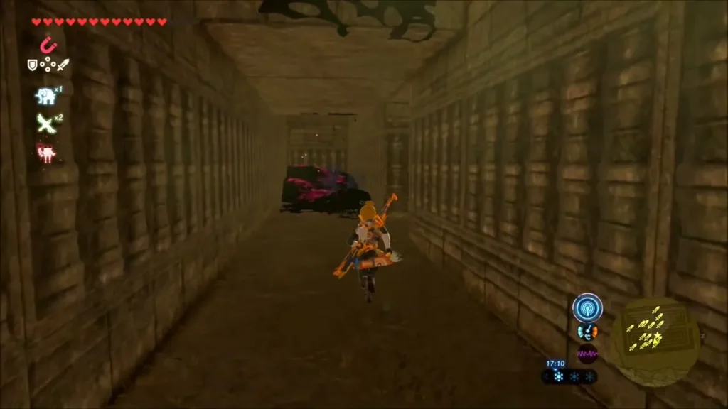 Link heading down a long labyrinth hall toward a dark obstacle
