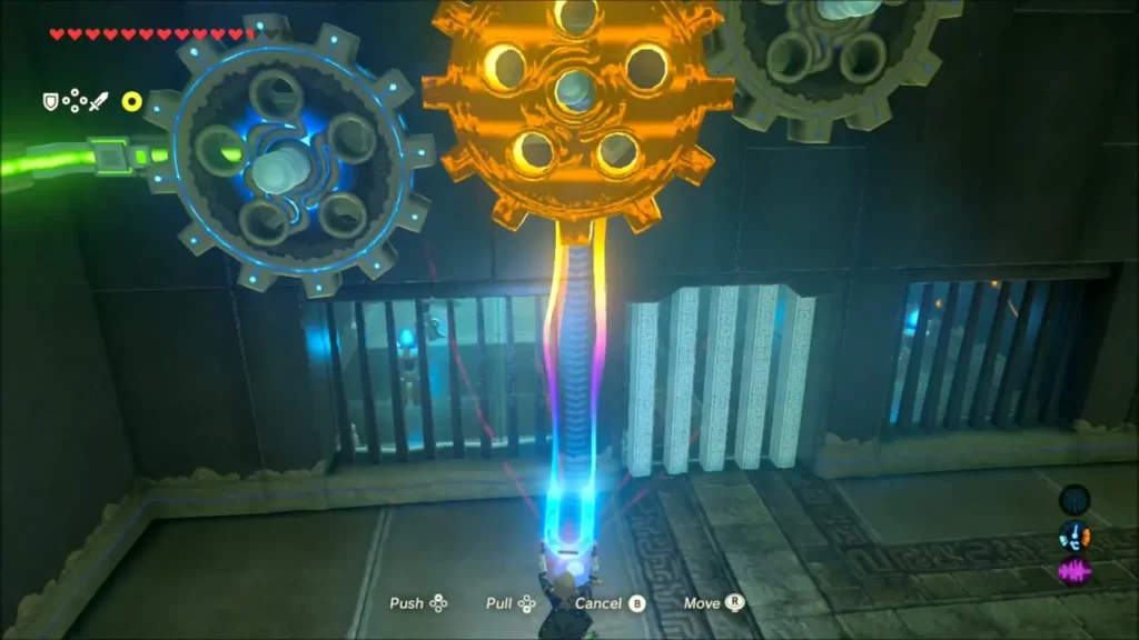 The large gear lifted beside the gears above the monk's gate The large gear lifted beside the gears above the monk's gate