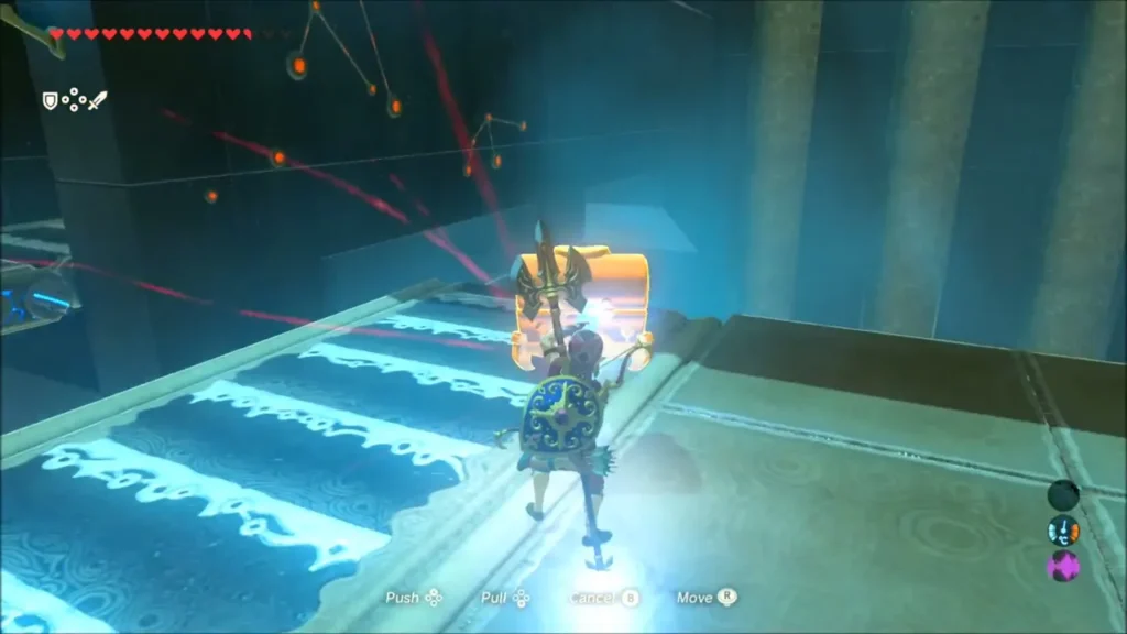 Link pulling a metal chest toward him with Magnesis