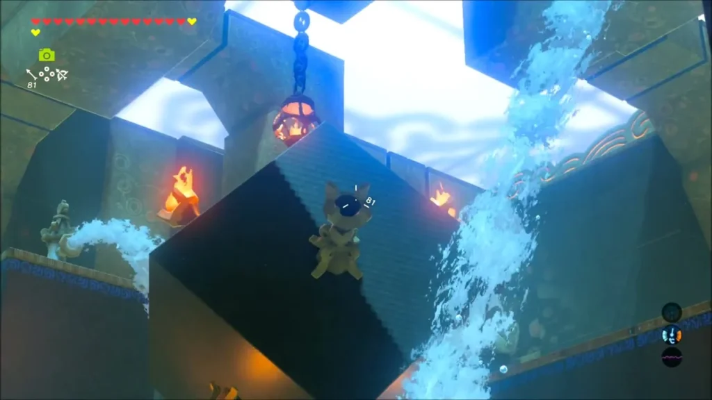 Lit torches on the cube beside a waterfall, seen from below Lit torches on the cube beside a waterfall, seen from below