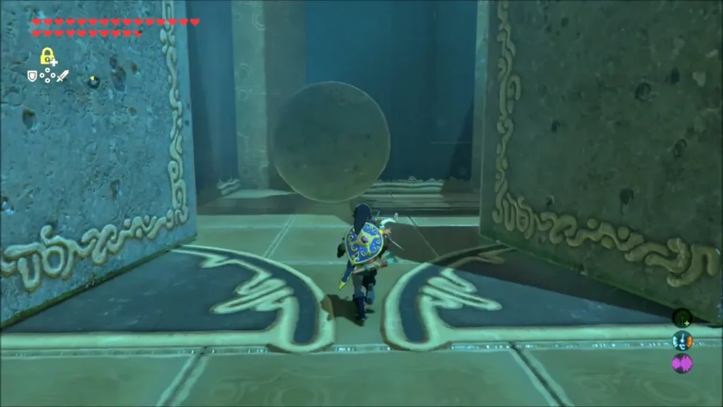 A large boulder rolling toward the doors ahead of Link A large boulder rolling toward the doors ahead of Link