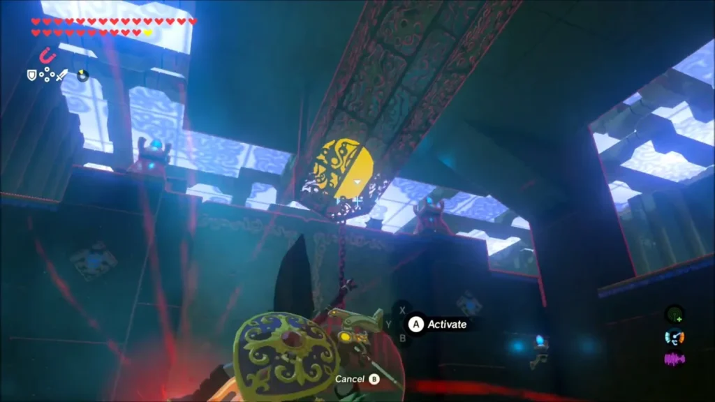 Link aiming Magnesis at the chain anchor above a hanging boulder in Kaam Ya'tak Shrine Link aiming Magnesis at the chain anchor above a hanging boulder in Kaam Ya'tak Shrine