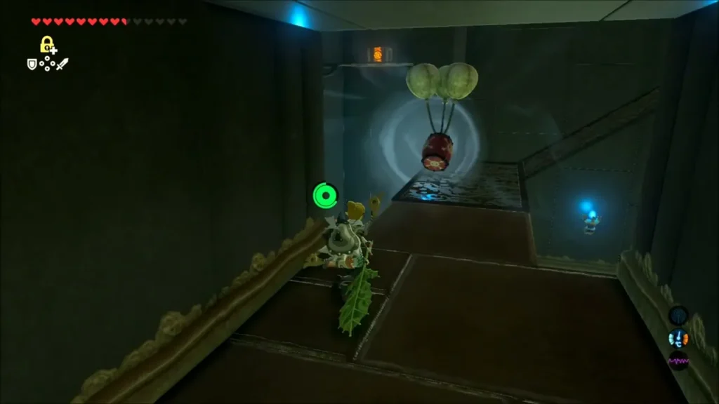 Link holding the Korok Leaf in a corridor with a balloon-borne barrel ahead Link holding the Korok Leaf in a corridor with a balloon-borne barrel ahead