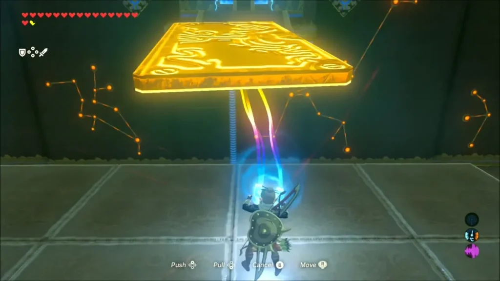 Link pulling a large metal block with Magnesis in the shrine hall Link pulling a large metal block with Magnesis in the shrine hall