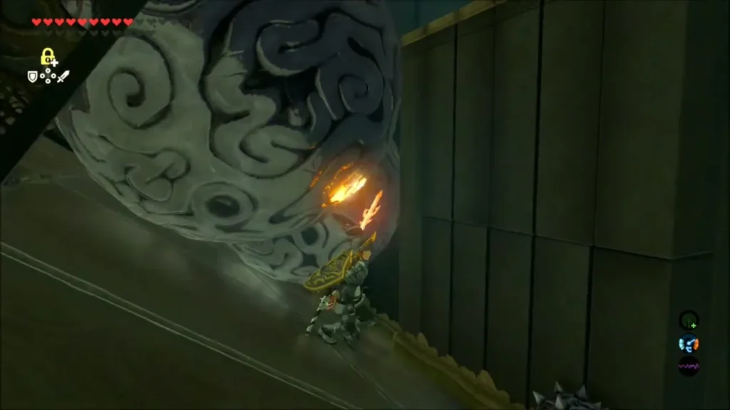 Link pressed to the wall as a huge stone ball rolls past Link pressed to the wall as a huge stone ball rolls past