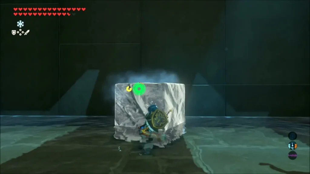 Link carrying an ice block toward the cliff base inside Kee Dafunia Shrine Link carrying an ice block toward the cliff base inside Kee Dafunia Shrine