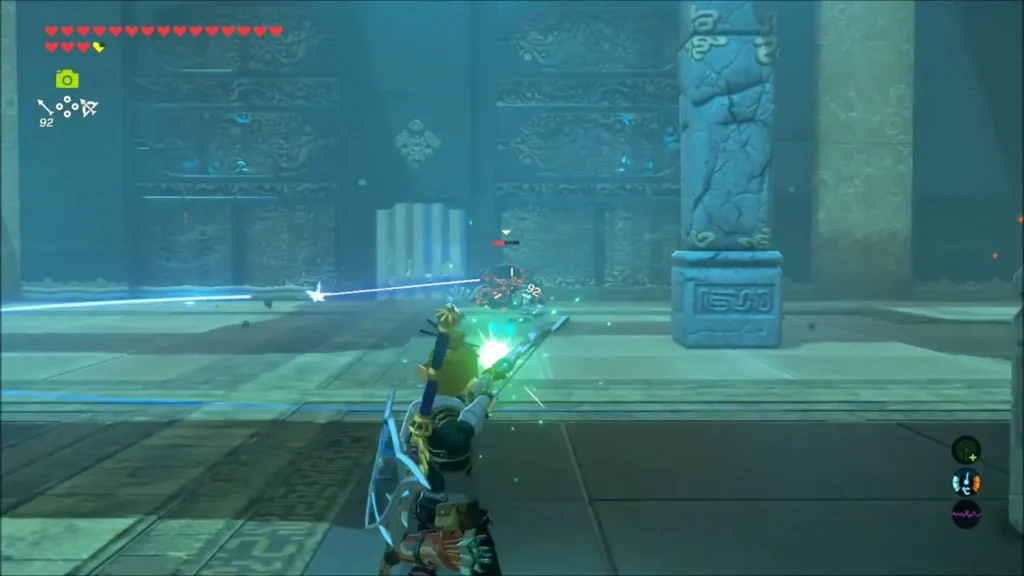 Link firing an arrow at the Scout III across the shrine floor Link firing an arrow at the Scout III across the shrine floor