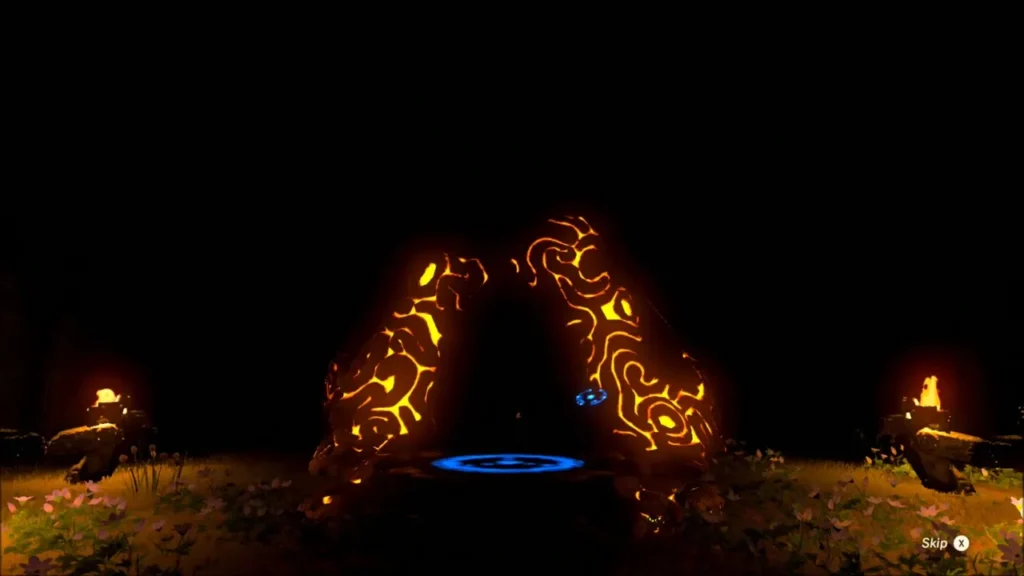 Glowing orange shrine entrance flanked by two lit statues in the dark Glowing orange shrine entrance flanked by two lit statues in the dark