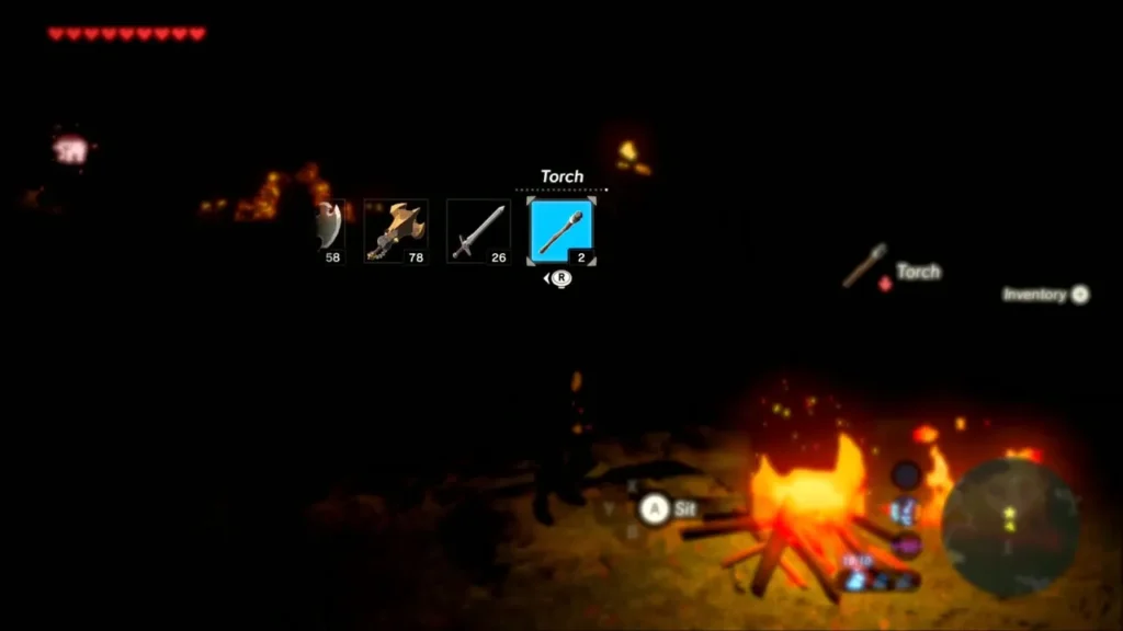 Link equipping a torch from the weapon wheel beside a campfire at night Link equipping a torch from the weapon wheel beside a campfire at night