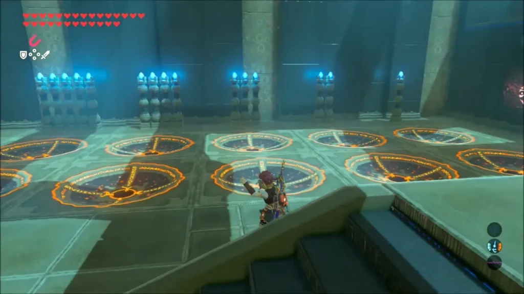 Link on the stairs before the coloured slots with torches beside them Link on the stairs before the coloured slots with torches beside them