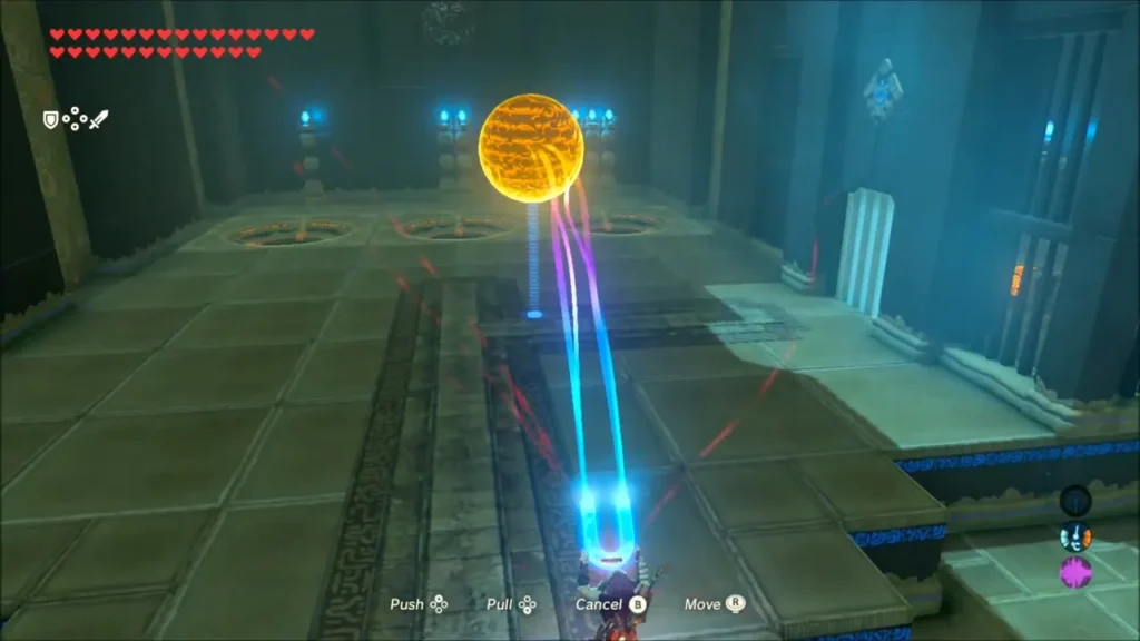 Link steering a metal orb with Magnesis toward the slot Link steering a metal orb with Magnesis toward the slot