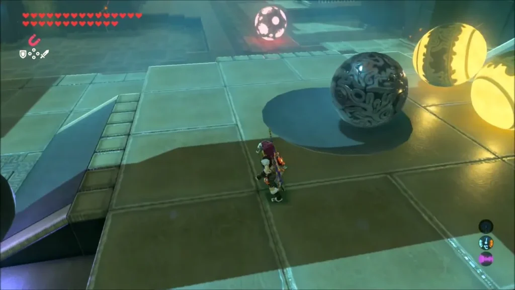 A grey metal orb on the floor among glowing orbs A grey metal orb on the floor among glowing orbs